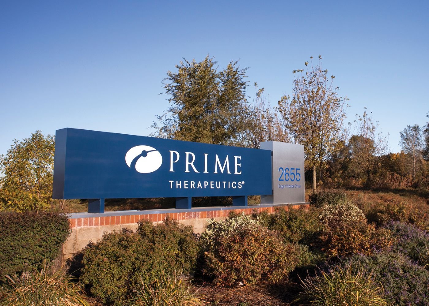 A sign featuring Prime Therapeutics' logo outside a corporate office.