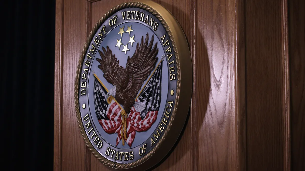 The sign of the Veterans Affairs Department is hung on the podium during a news conference at Veterans Affairs Department September 8, 2014