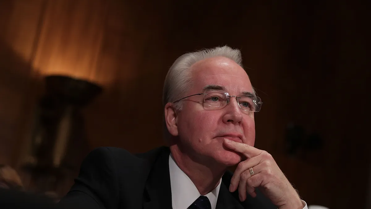 A photograph of Tom Price in a suit, sitting at a table during a Congress confirmation hearing